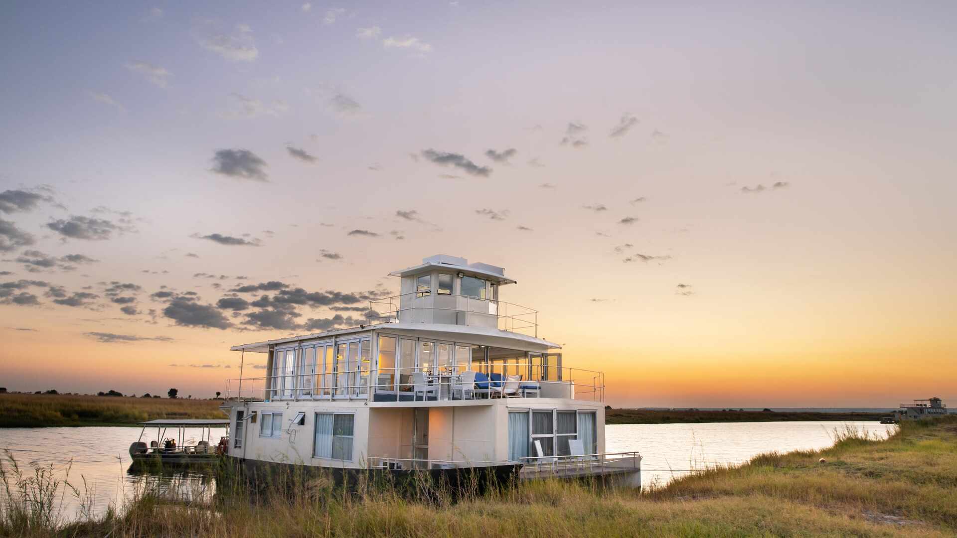 The Chobe Princess docked during a sunset